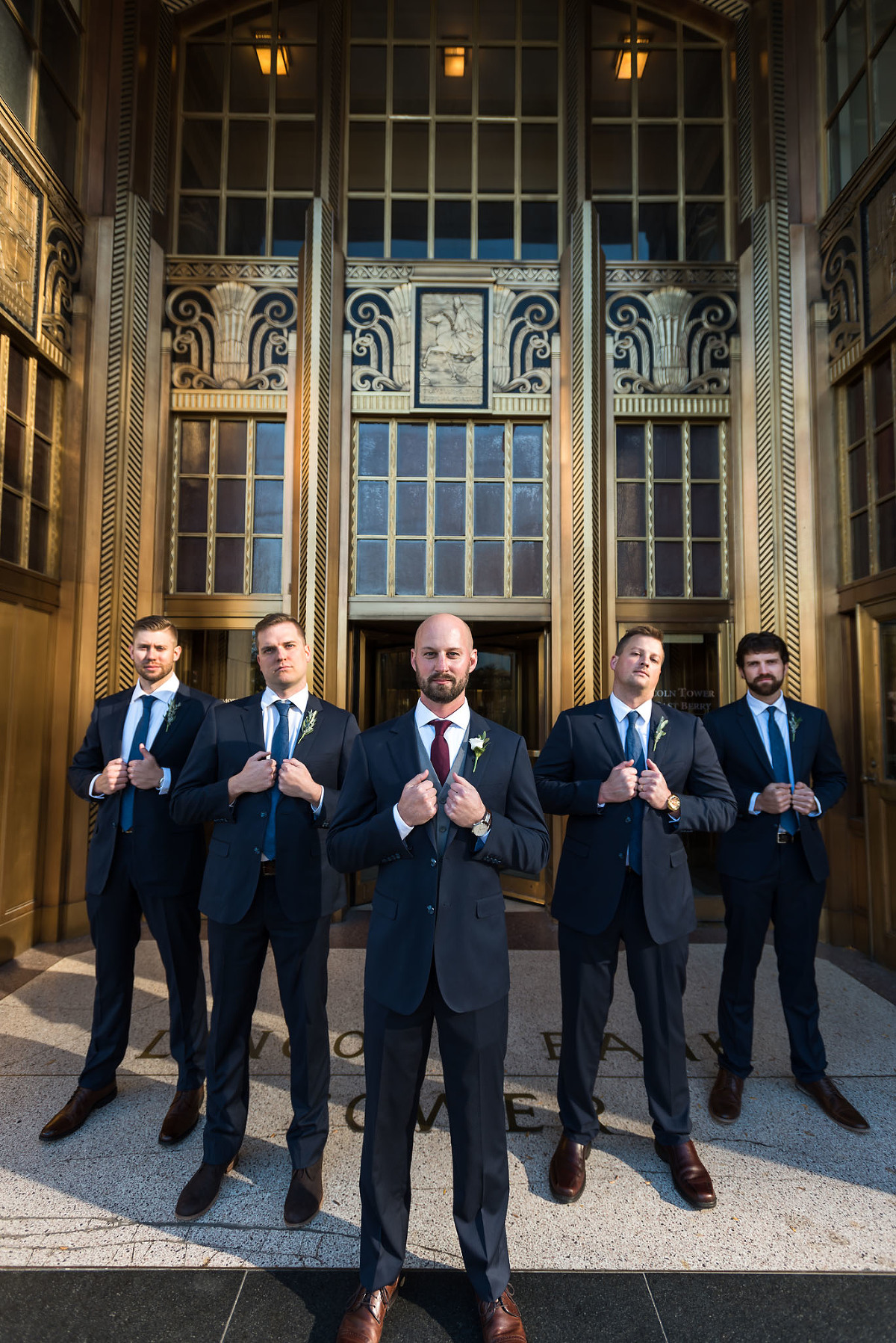 Bridal party portraits, groomsmen, wedding party, Fort Wayne Bride, downtown Fort Wayne, Lincoln Tower Bank, Allen County Courthouse, Fort Wayne, Indiana wedding photography by Kasey Wallace Photography